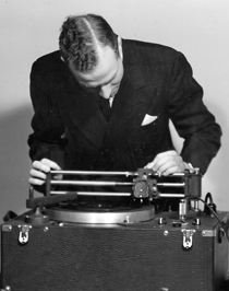 Image of Ray H Moore with first recording equipment 1941